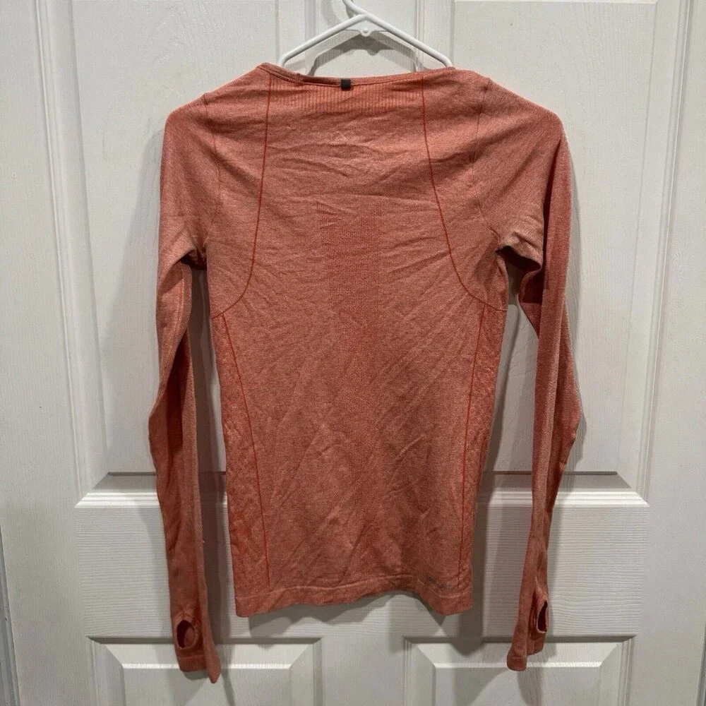 Women’s Nike‎ Womens orange dri fit long sleeves Xsmall Xs Seamless Thumb Holes